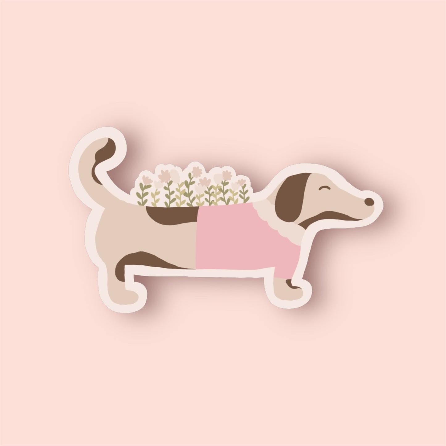 Vinylsticker mit Dackelmotiv in Pastelltönen auf rosa Hintergrund.